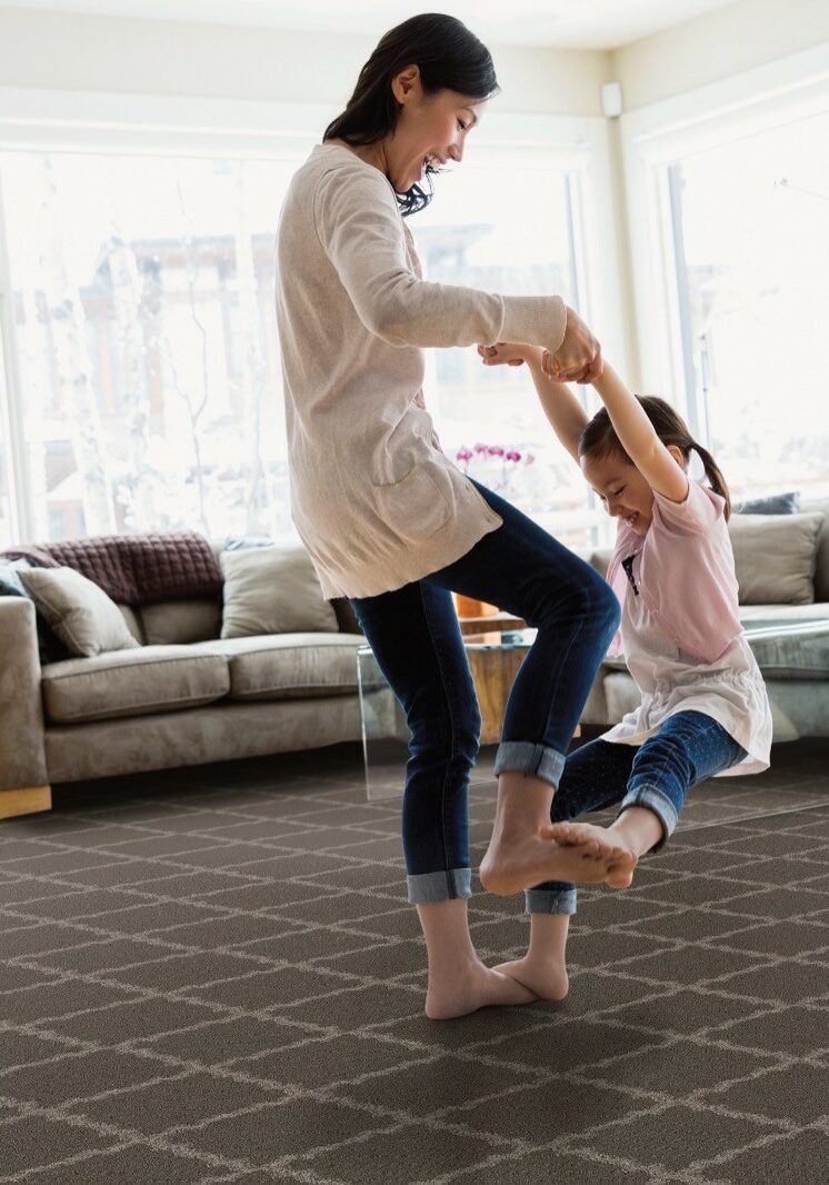 Baby girl playing with mom | Henson's Greater Tennessee Flooring